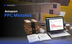 Brandock web banner titled "Amazon PPC Mistakes" displaying a laptop showing declining ad performance charts alongside Amazon Prime shipping boxes and a notebook listing campaign errors.