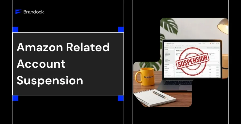A split-screen promotional banner addressing an Amazon Related Account Suspension by Brandock. The left side features a dark grey block with the bold title headline text accented by bright blue corner squares, with the blue corporate Brandock logo positioned at the top left. The right side displays an office desk setting framed within an abstract cutout layout. On the wooden desk sits an open laptop displaying an Amazon Seller Central dashboard with a large red, circular "SUSPENSION" stamp overlaid on the screen. A yellow Brandock-branded ceramic coffee mug, an open spiral notebook with a pen, a cardboard shipping box, and a warm desk lamp complete the workspace setting.