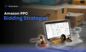 Brandock web banner titled "Amazon PPC Bidding Strategies" showing a laptop displaying an Amazon PPC dashboard alongside a wooden gavel, a megaphone, and a bid sign.