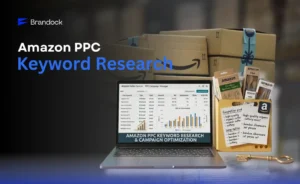 Brandock web banner titled "Amazon PPC Keyword Research" displaying a laptop open to an Amazon PPC Campaign Manager dashboard next to a box of keywords and product notes.